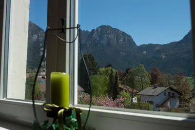 a window with a view of a mountain at Gasthof Albergo Kreuzwirt in Fiè