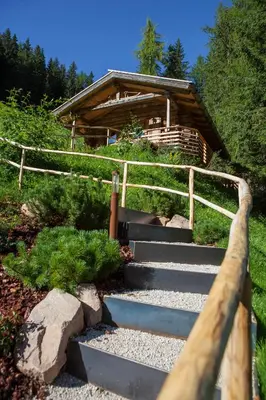 a set of stairs leading to a cabin at Residence Merk in Selva di Val Gardena