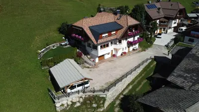 an overhead view of a house with a roof at Appartamenti Ciasa Linda in San Martino in Badia