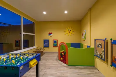 a childs play room with a pool table at Alpin Hotel Gudrun in Colle Isarco