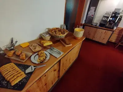 a buffet with various types of food on a table at Garni Weingut in Merano