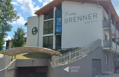 a building with a sign that reads berner at Hotel Brenner - Stop & Go in Vipiteno