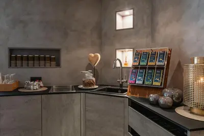 a kitchen with a sink and a counter top at Hotel Brenner - Stop & Go in Vipiteno