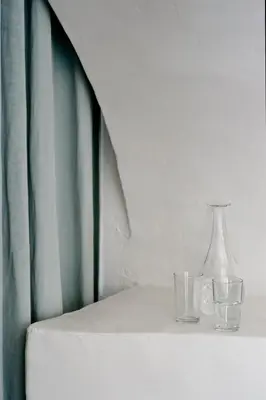 two glasses and a vase sitting on a table at 1477 Reichhalter, a Member of Design Hotels in Lana