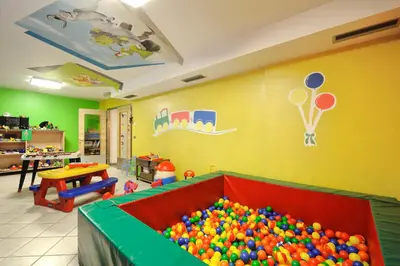 a room with a large pile of balls in a tub at Sport Hotel S. Vigilio in Moena