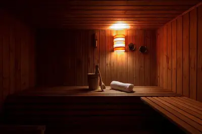 a sauna with a towel and a light on the wall at Digonera Historic Hotel B&B in Rocca Pietore