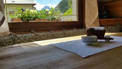a bowl of tooth brushes sitting on a table with a window at Digonera Historic Hotel B&B in Rocca Pietore