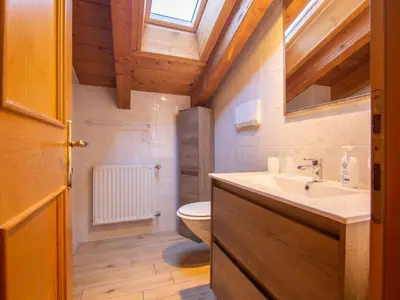 a bedroom with two beds and a window at Apartment Garni Eden by Interhome in Soraga