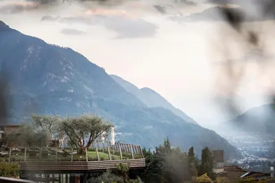 a view of a mountain with a town and a city at SPA & Relax Hotel Erika in Tirolo