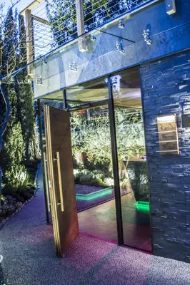 an open door to a garden in a building at SPA & Relax Hotel Erika in Tirolo