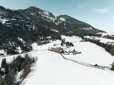 a ski lodge in the snow with a mountain at La Cort My Dollhouse - Adults Only in Ortisei