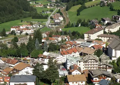 an aerial view of a town with houses and trees at Gasthof Moarwirt in Colle Isarco