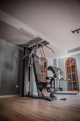a room with a gym with a treadmill at Anett hotel in Vipiteno