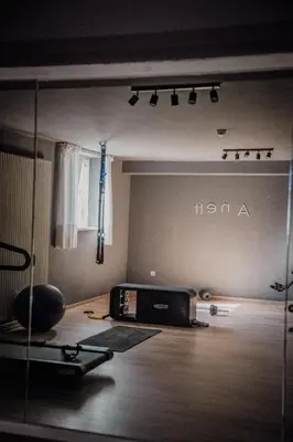 an empty room with a radio and a window at Anett hotel in Vipiteno