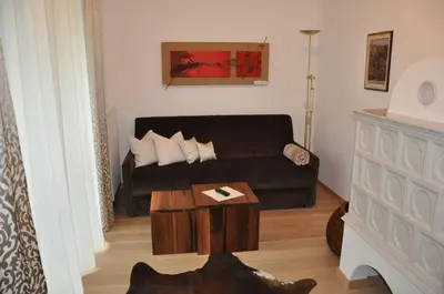 a living room with a couch and a coffee table at Gästehaus Pfuss in Caldaro
