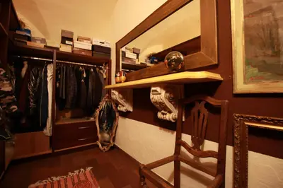 a room with a closet with hangers and a shelf at Maso Valfloriana in Valfloriana