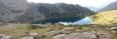 a lake on the side of a mountain at Maso Valfloriana in Valfloriana