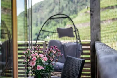 a basket of apples sitting on a table at Appartements Toni in Feldthurns