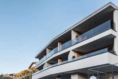 an apartment building with balconies on the side at Dornsberg Panoramic Apartments in Schenna
