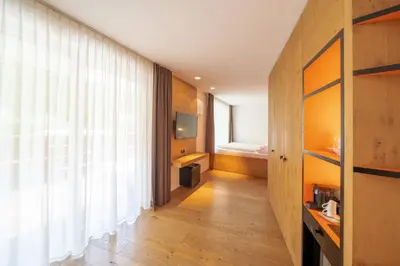 a table with a plate of food and a cup of coffee at Soley Suites - adults only in Bressanone