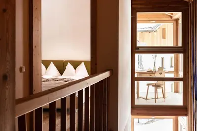 a bedroom with a bed with white pillows on it at CHALET D'ERT in La Valle