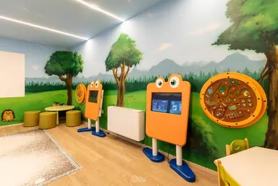 a room with two vending machines in front of a wall at Family Hotel La Perla in Fiera di Primiero