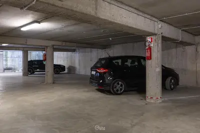 a small car parked in a parking garage at Family Hotel La Perla in Fiera di Primiero