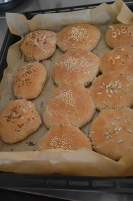 a baking pan filled with buns on top at Falkenau in Chienes