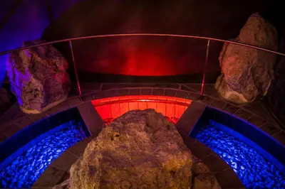 an overhead view of a fire place with rocks at Dolomites Living Hotel Tirler in Alpe di Siusi