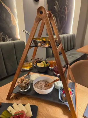 a tray of food on top of a table at Cësa Panaval Apartments in Santa Cristina in Val Gardena