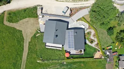 an aerial view of a building with a solar panel on it at Chalet Frieda in Mühlbach