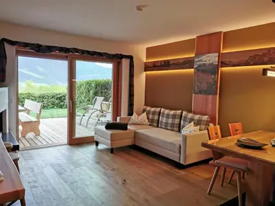 a living room with a couch and a table at Chalet Frieda in Mühlbach