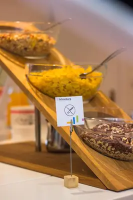 a display case with different types of cookies and pies at Pension Lichtenburg in Nalles