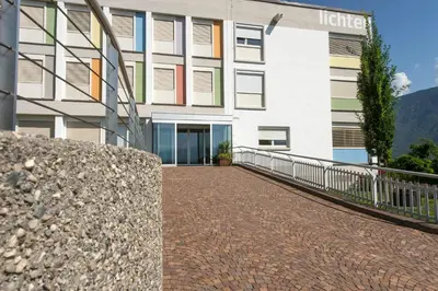 a brick walkway in front of a building at Pension Lichtenburg in Nalles