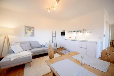 a living room with a couch and a table at La Vinea in Caldaro