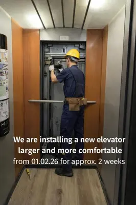 a man is installing a new elevator larger and more comfortable at Hotel Comfort Erica Dolomiti Val d'Adige in Salorno sulla Strada del Vino
