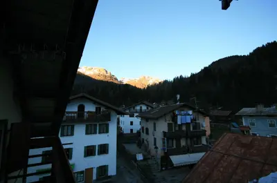 a view of a town with mountains in the background at Casa Katia in Canale dʼAgordo