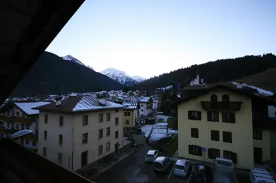 a view of a town with mountains in the background at Casa Katia in Canale dʼAgordo