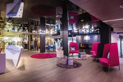 a store with pink chairs and a pink rug at Preidlhof Luxury Dolce Vita Resort in Naturno