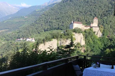 a castle on the side of a mountain at Villa Falkner in Tirolo