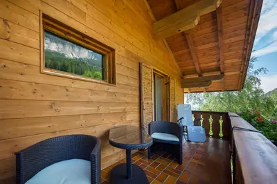 a screened in porch with chairs and a table at Thalerhof Tiers in Tires