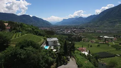 a view of a village in a valley with mountains at Appartement Trafoier in Tirolo