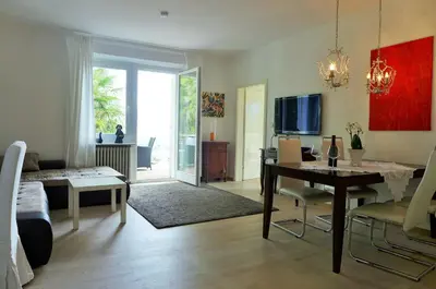 a living room with a table and a dining room at Appartement Trafoier in Tirolo