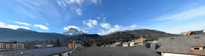 a view of a town with mountains in the background at Continental 101- 4 beds in San Vito di Cadore