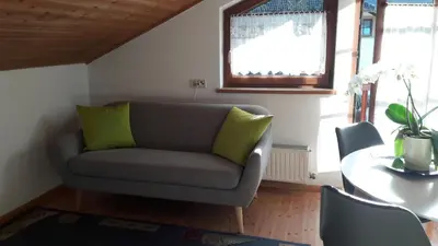 a living room with a couch and a table at 