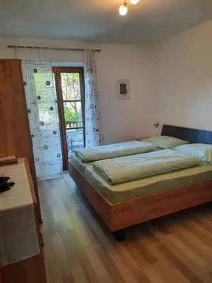 a bedroom with two beds and a window at 