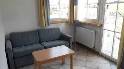 a living room with a couch and a coffee table at Apartment Residence Volgger in Brunico