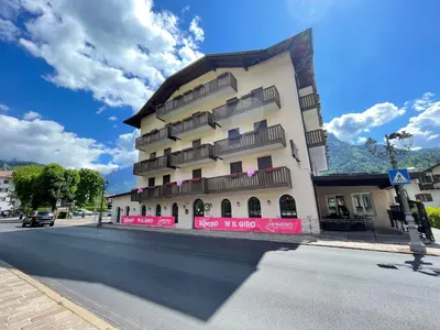 a tall building on the side of a street at Albergo Dolomiti in Fiera di Primiero