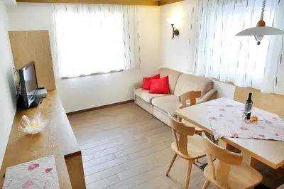 a living room with a couch and a table at Apartment Kristyn in Ortisei
