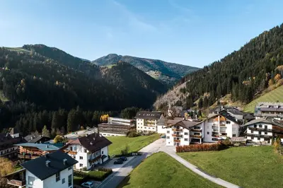 an aerial view of a village in the mountains at Piculin Alpin Apartments in San Martino in Badia